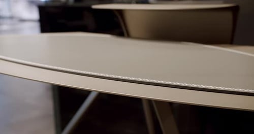 Close Up Work Table with Leather and White Stitching Wood on a Comfortable Room