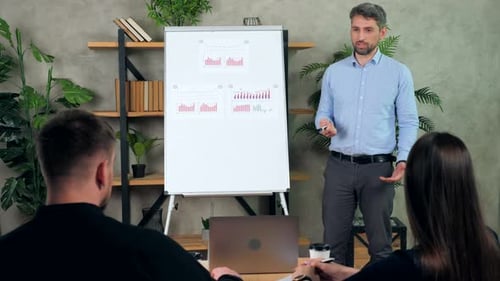 Man coach teaches tells offline online employees company financial literacy