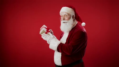 Santa Claus Holding a Christmas Gift