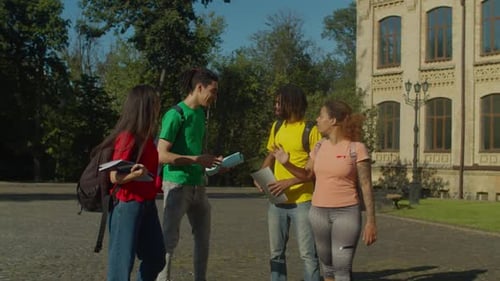 Friends Walking and Hugging on College Campus