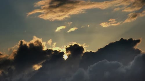 Sun Bursts Through Storm Clouds at Sunset