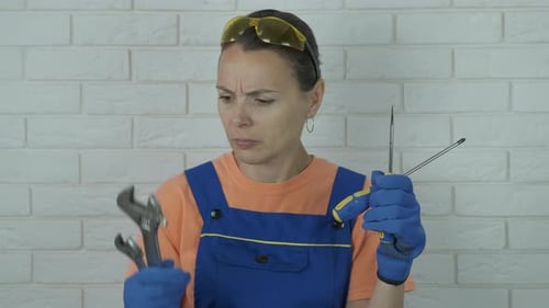 Woman Inspecting Tools for Home Repair Project