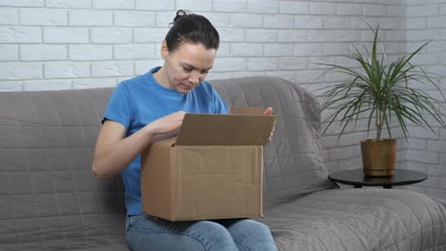 Woman Opens Box, Disappointed With Delivery