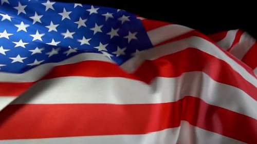 American Flag Waving Against a Black Background