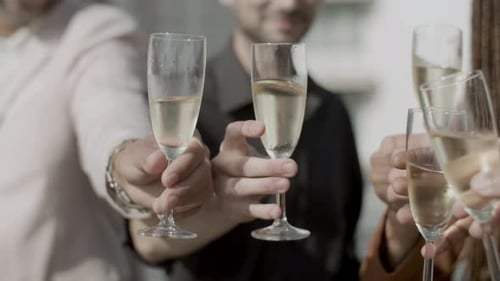 Friends Toasting Champagne in a City Celebration