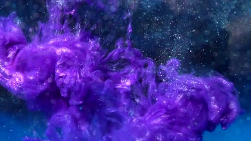 Metallic purple luminescent ink drop flowing in liquid water with particles and bokeh lights on a da
