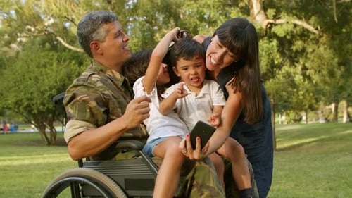 Smiling Family Taking Selfie in Sunny Park
