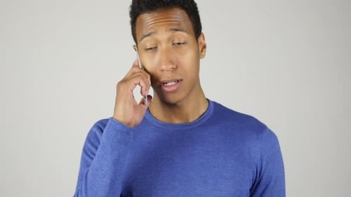 Young Adult Talking on Mobile Phone