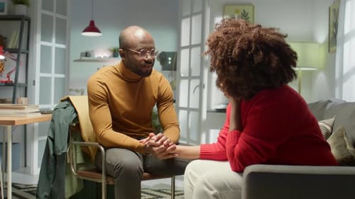 Couple Having Difficult Conversation in Home Living Room