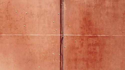 Overhead Shot of a Tennis Player Who Stands and Hits the Ball During a Sports Practice on an Outdoor