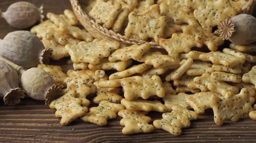 Delicious Crackers with Poppy Seeds on Wooden Table