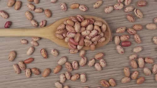 Overhead Shot of Pinto Beans and Wooden Spoon