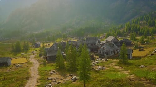 Aerial View of Rustic Mountain Village in Misty Valley