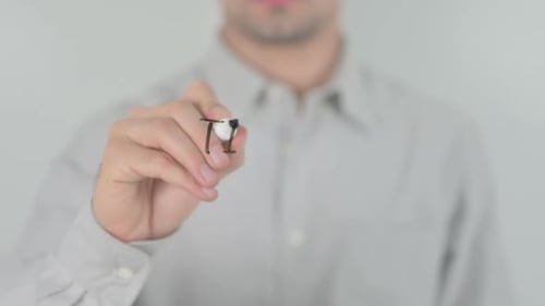 Adult Writing 'Time to Relax' On Glass