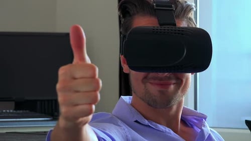 Adult Using Virtual Reality Headset Giving Thumbs Up