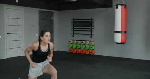 Woman Training in a Boxing Gym, Barefoot