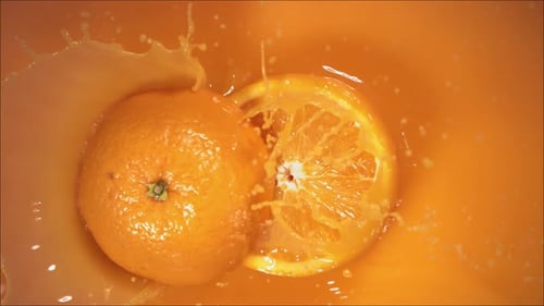 Orange Splashing into Refreshing Juice