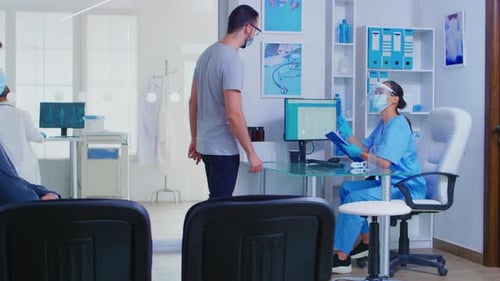 People Waiting in Doctor's Office Exam Room