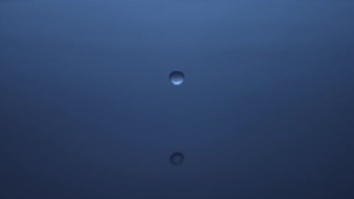 Macro Shot of Ripples in Dark Blue Liquid