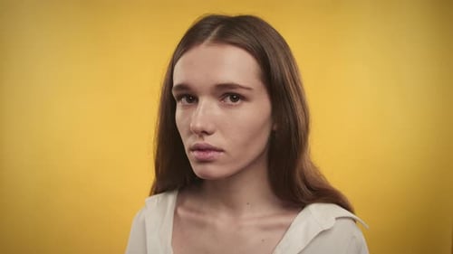 Portrait of a Serious Young Woman in Studio