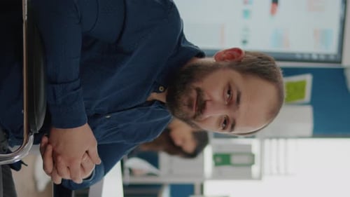 Man in Navy Shirt Looking at Camera