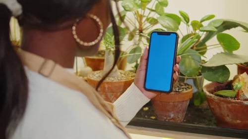 Forist African American Woman Holding Phone with Chroma Key