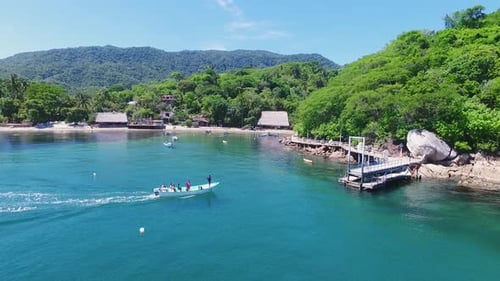 Tropical Bay with Boat, Dock, and Beachfront