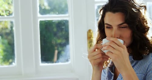 Woman having coffee in restaurant