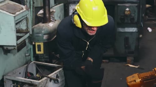 Factory Worker Injured By Accident While Using Machine in Factory