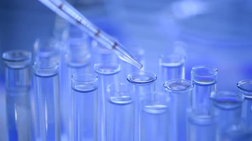 Dropping Liquid Into Test Tube For Research