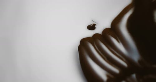 Pouring Melted Dark Chocolate