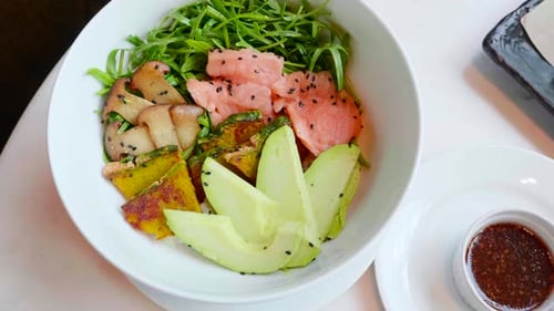 Salmon Poke Bowl with Avocado Zucchini Top View
