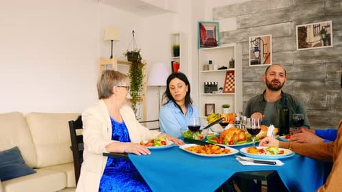 Family and Friends Enjoying Festive Meal Together