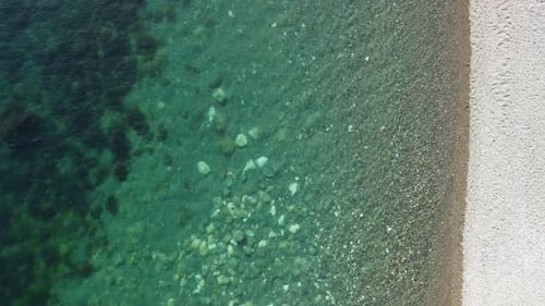 Aerial View on Calm Azure Sea and Volcanic Rocky Shores