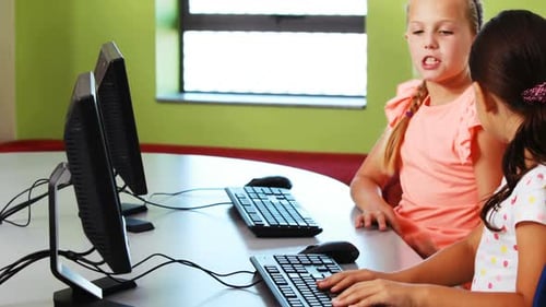 Girls Using Computers in Classroom