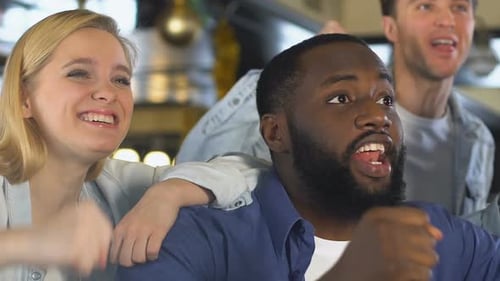 Multiethnic Fans Watching Sport Game in Pub, Cheering for Favorite Team Victory
