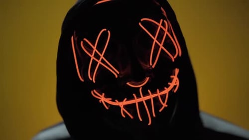 Hooded Figure in Glowing Scary Halloween Mask