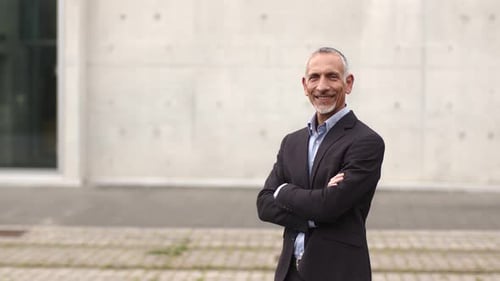 Successful businessman looking at camera