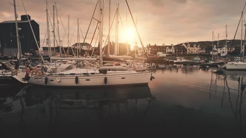 Closeup Sunset Over Yachts at Ocean Marina Aerial