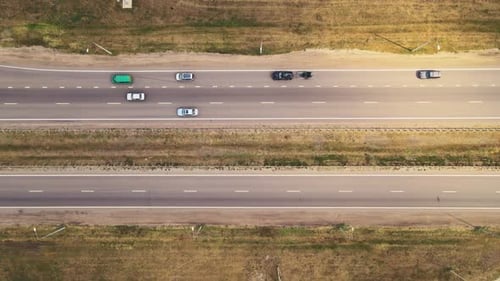 Top view of Asphalt straight road with Traffic cars driving