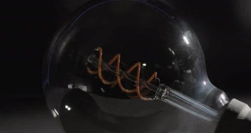 Lightbulb Illuminates in a Dark Room