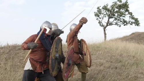 Historic Warriors Battle on Grassy Hillside