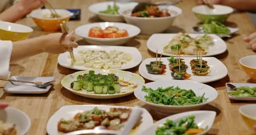 Delicious Dishes Shared Around Table with Friends