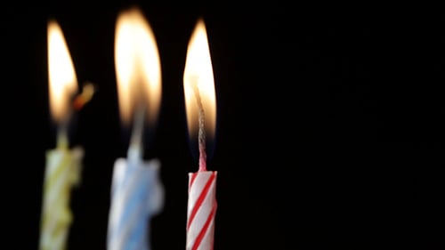 Candles Rotating on Black Background 2