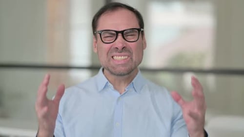 Man Expressing Anger and Frustration in Close Up