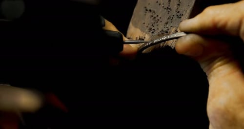 Goldsmith manufacturing bangle in workshop 4k