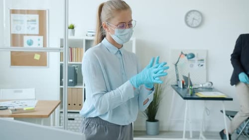 Slow Motion of Colleagues Man and Woman Washing Hands with Sanitizer and Talking in Office