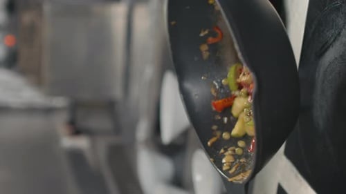 Vegetables With Sauce Spilling From Pan