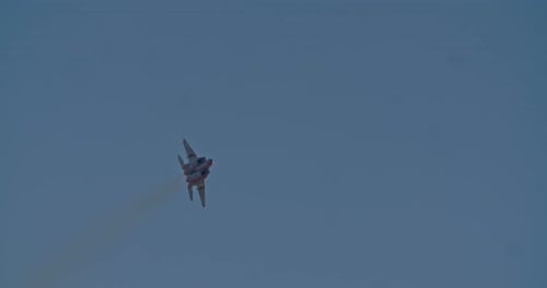 Fighter Jet Soaring Through the Clear Blue Sky