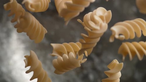 Rotini Pasta Dropping Into Boiling Water in Macro Shot